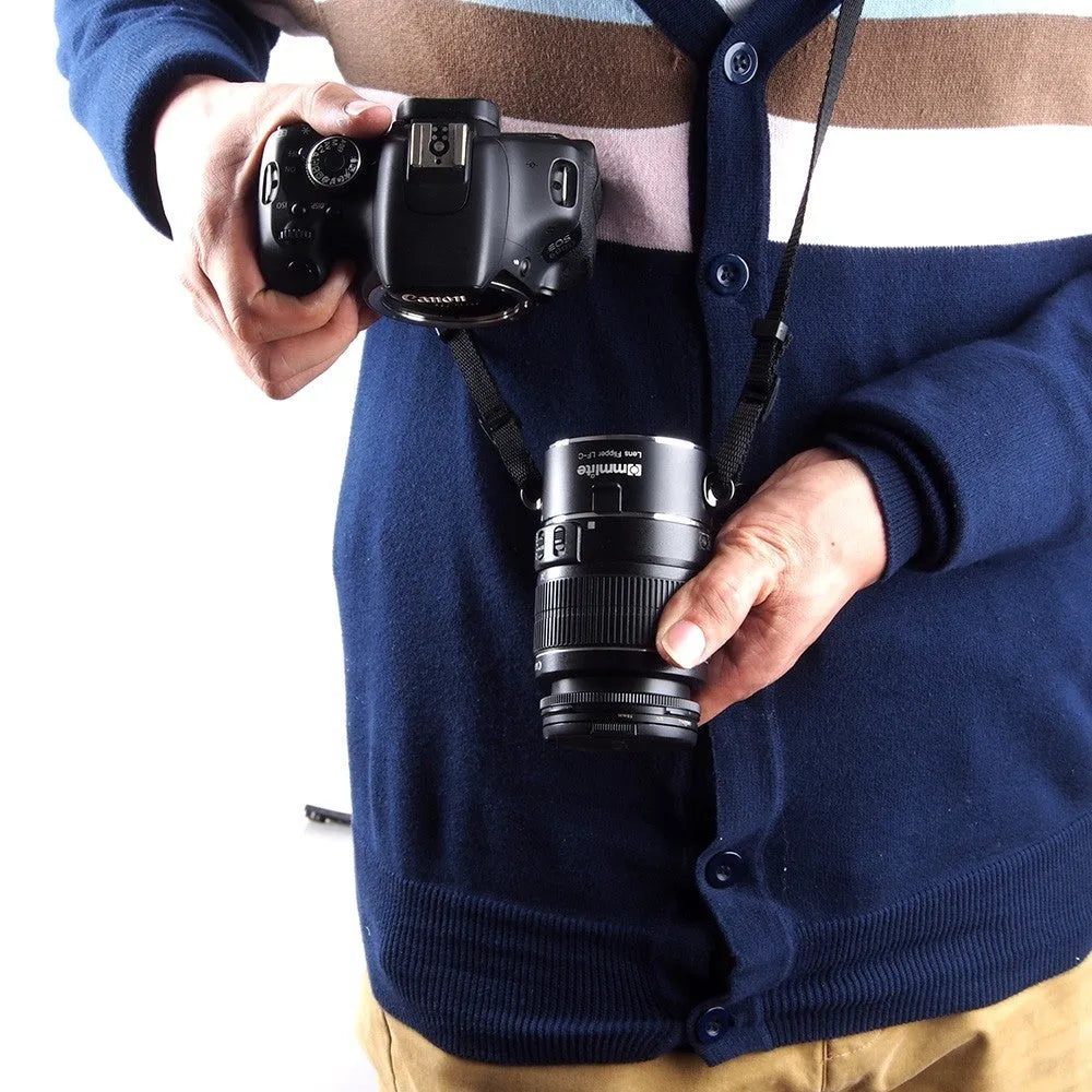 Aluminium alloy Nikon camera lens flipper dual holder with stainless steel buckle and cotton strap.