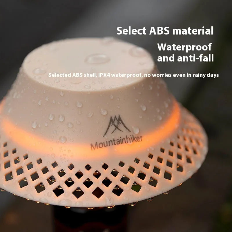Camping lantern with wine bottle shade design in beige colour showing USB-C charging port