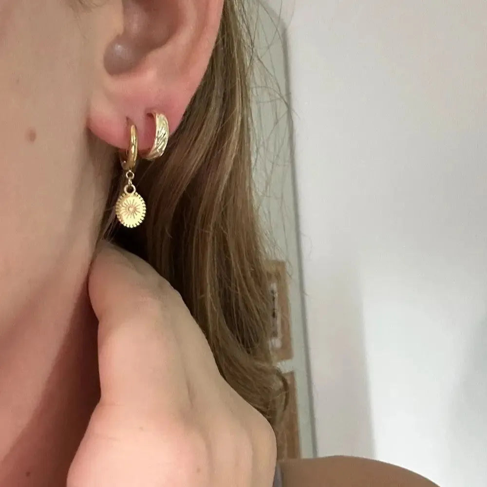 A pair of stainless steel geometric button earrings with ellipse detail, colour XY-EH005.