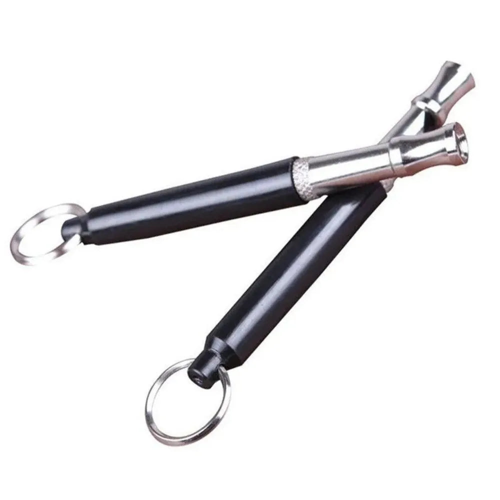 Copper ultrasonic dog training whistle with keychain cord and iron ring in black colour on white background