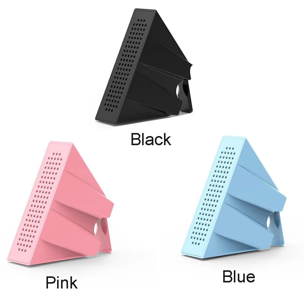 Portable Apple-compatible phone amplifier bracket in multiple colours on desktop