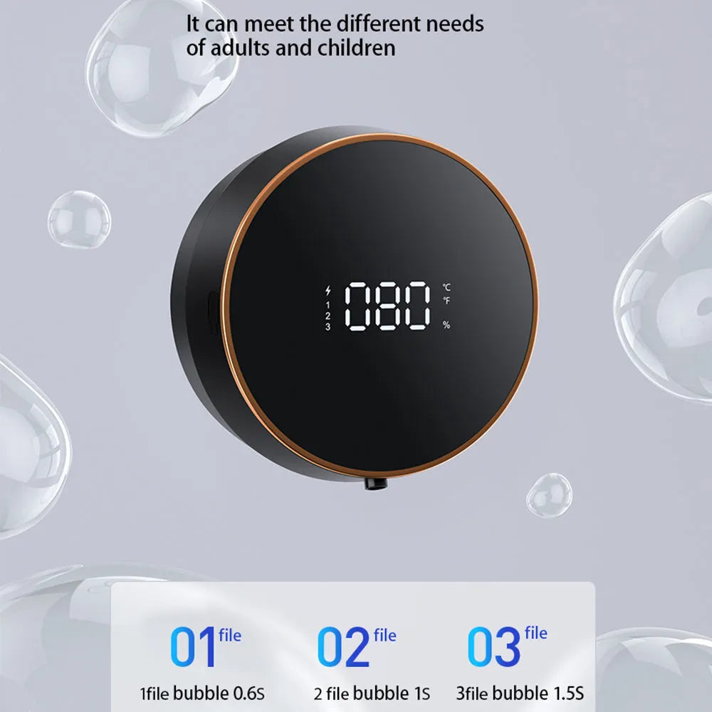 Black automatic touchless foam soap dispenser mounted on a wall with USB charging cable.