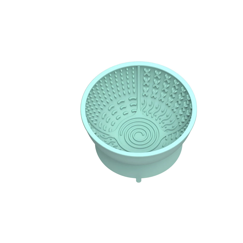 Cyan pet slow feeder bowl with suction cup base and textured interior for controlled feeding