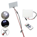 White LED fishing rod light with telescopic pole extended, showing remote control.