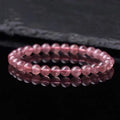 Women's strawberry quartz crystal bracelet with polished beads, showing size options of 6mm, 8mm, and 10mm.