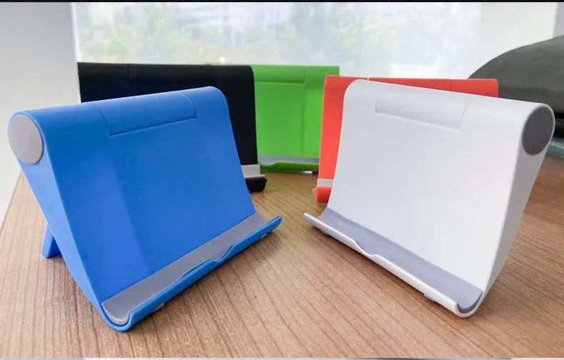 PE folding mobile phone stand in multiple colours showing multi-angle adjustment for tablets and smartphones
