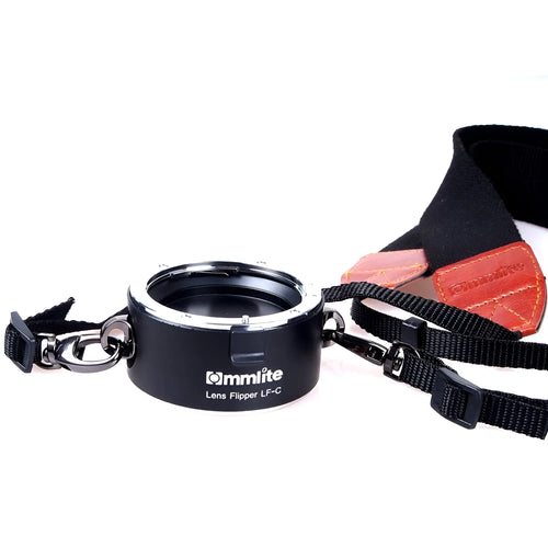 Aluminium alloy Nikon camera lens flipper dual holder with stainless steel buckle and cotton strap.