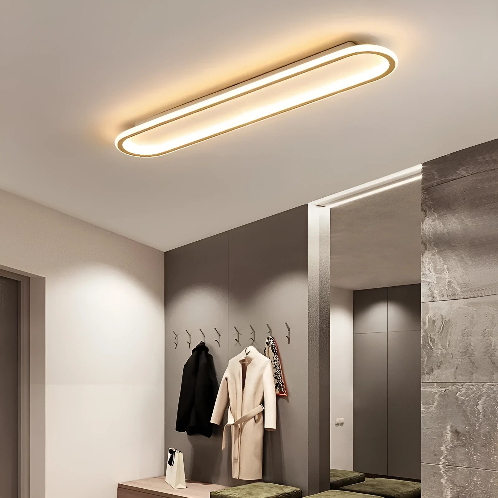 Black minimalist strip ceiling lamp mounted flush on a white ceiling.