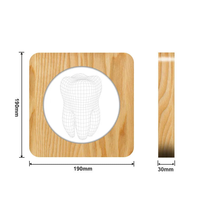 Tooth-shaped wood colour acrylic USB night light on a surface, showing its compact size.