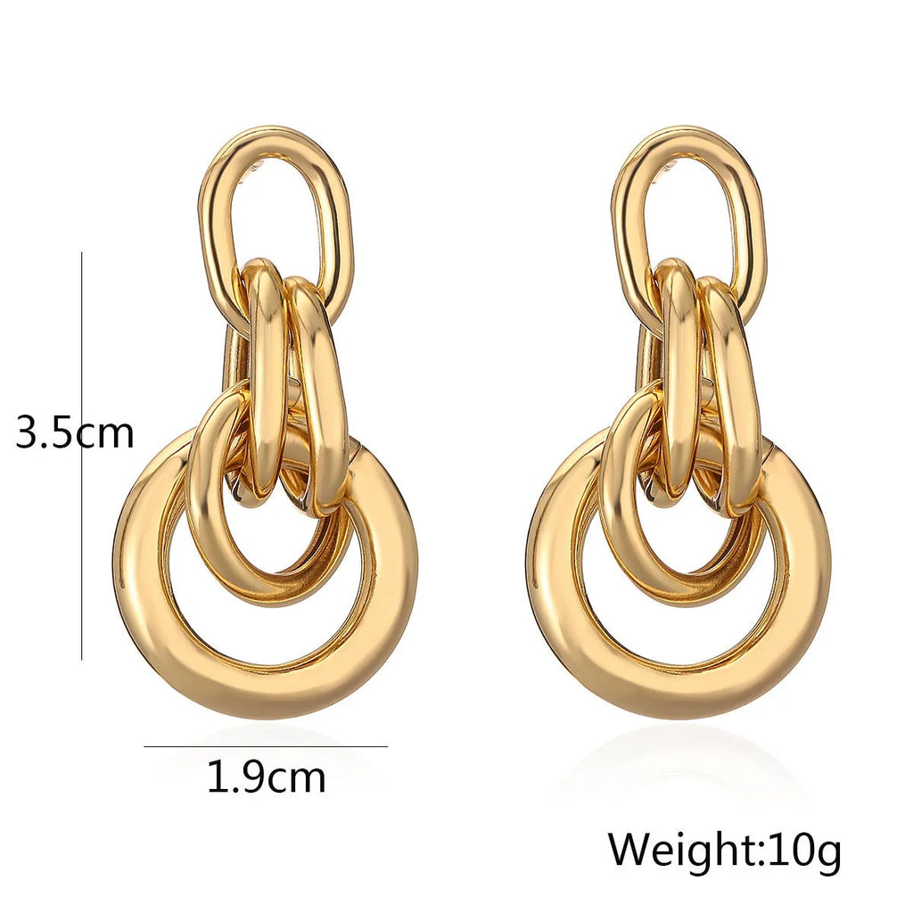 Gold geometric copper earrings with irregular shape and simple pierced design
