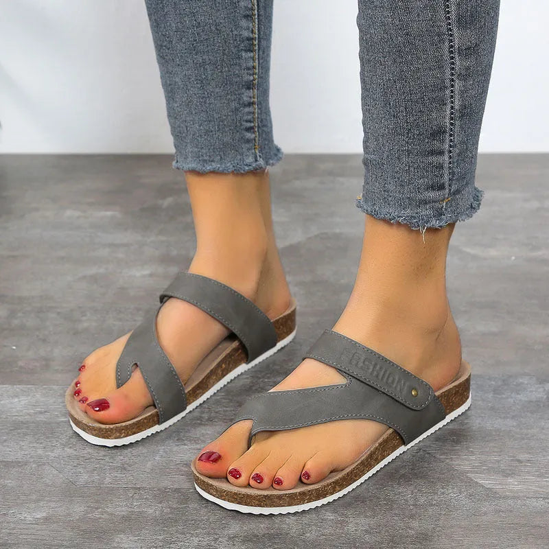 Flat toe ring thick-soled flip-flops in a solid colour on a foam sole.