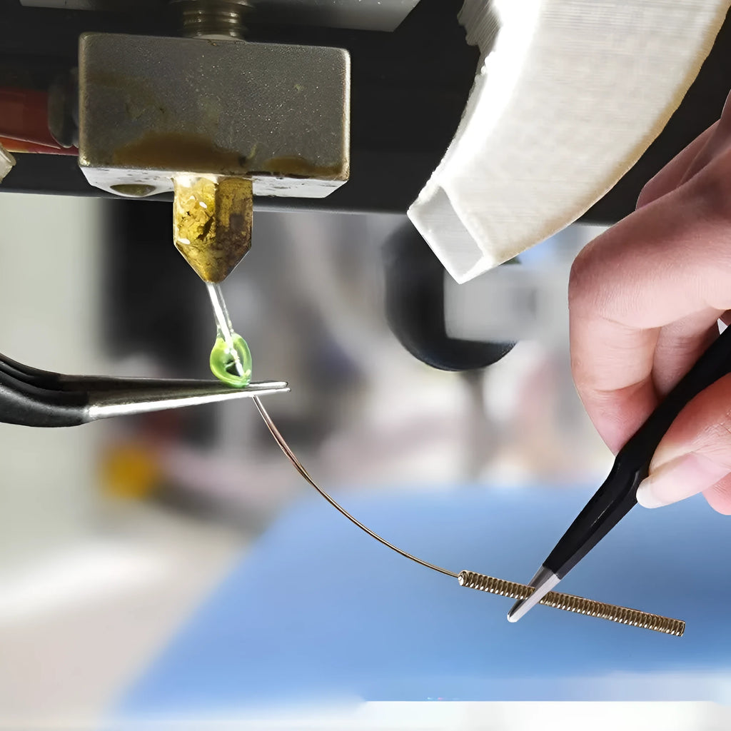 Brass MK8 3D printer nozzle and stainless steel cleaning pin kit on a white background.