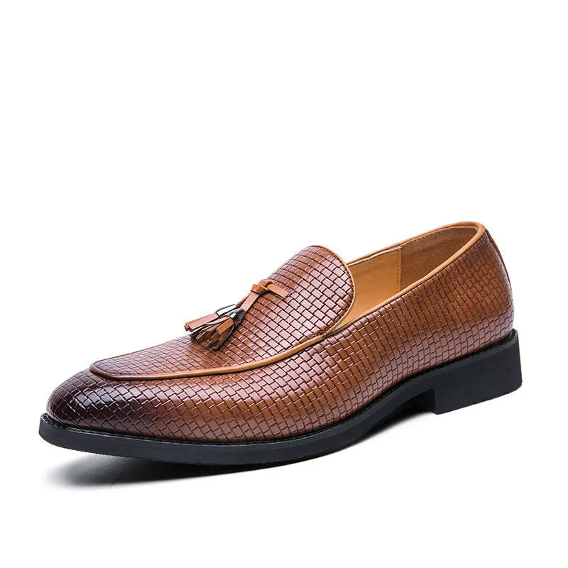 Men's black pointed toe slip-on shoes with a tassel detail on the vamp