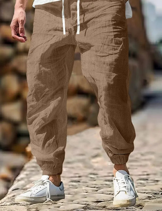 Men's straight-leg cotton trousers in apricot colour with an elastic waistband.