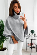 Women's long grey batwing cardigan with three buttons and stitching detail.