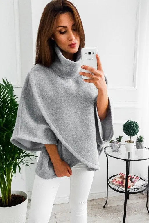 Women's long grey batwing cardigan with three buttons and stitching detail.
