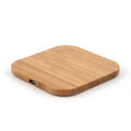 Square bamboo 5W wireless charging pad on a wooden table