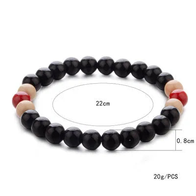 Natural stone beaded bracelet with ethnic design showing lava beads for essential oils