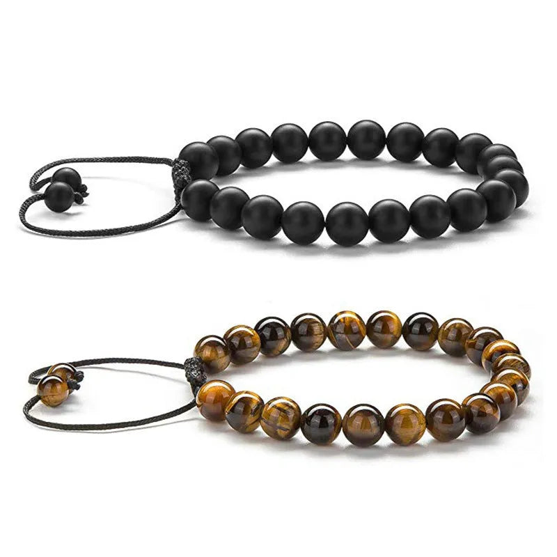 A pair of matte black agate bead bracelets with geometric design for him and her.