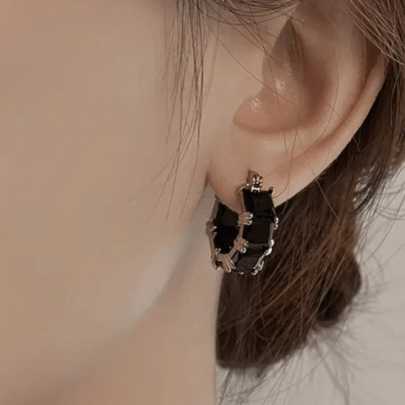 Geometric U-shaped women's earrings with crystal zirconium elements in black, pink, or white variants