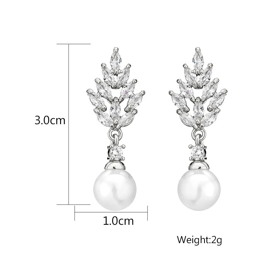 Geometric flower earrings with zircon stones and pearl accents in gold, white gold, or rose gold plating