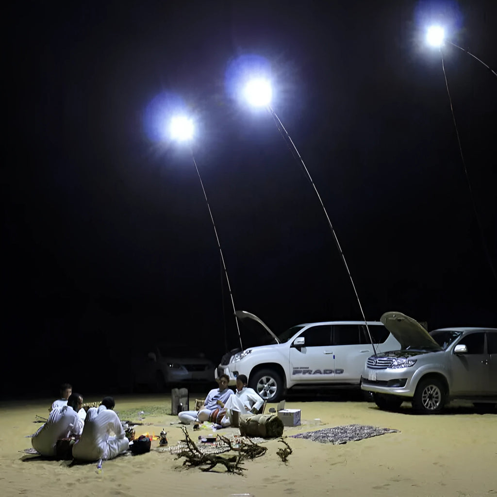 White LED fishing rod light with telescopic pole extended, showing remote control.