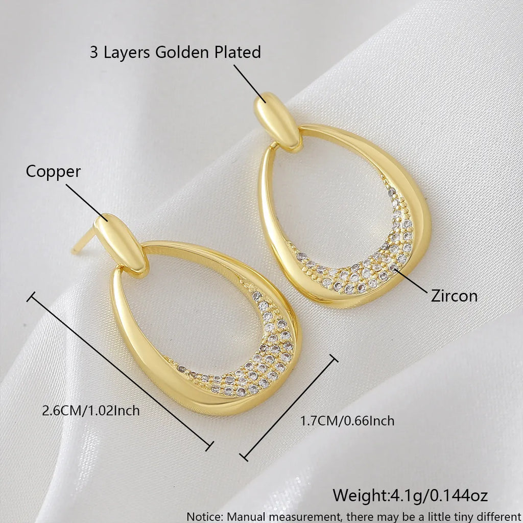 Yellow gold geometric drop earrings for women with zircon details, measuring 2.6cm by 1.7cm.
