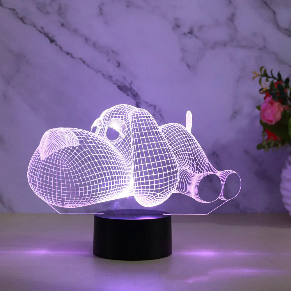 3D illusion dog lamp glowing with multi-colour light on a desk base