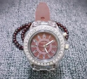 Women's LED luminous quartz watch with round 43mm alloy case and colourful silicone strap options.