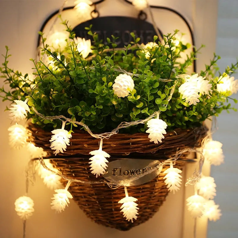 Warm white battery-powered LED pine cone decorative string lights shown in a 10-light or 20-light option.