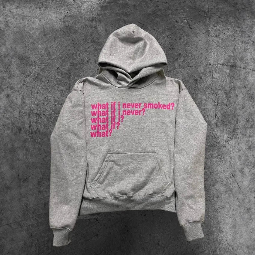Man wearing a black heavyweight hooded sweater with a large white letter print design on the front.