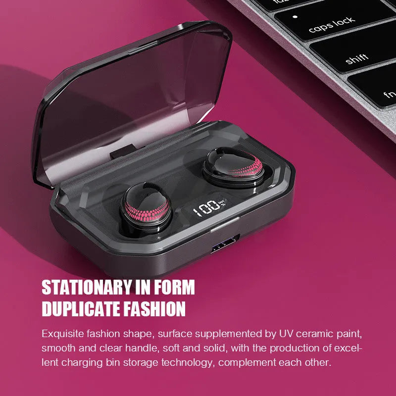 Black wireless Bluetooth headset with charging case on a table.