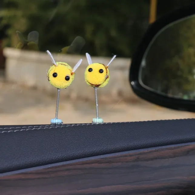 Cartoon bee car decoration ornament with furry ball material measuring 3x3cm