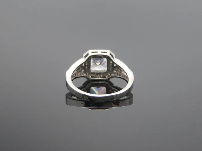 Platinum geometric zircon ring with hollow quadrilateral design on copper base