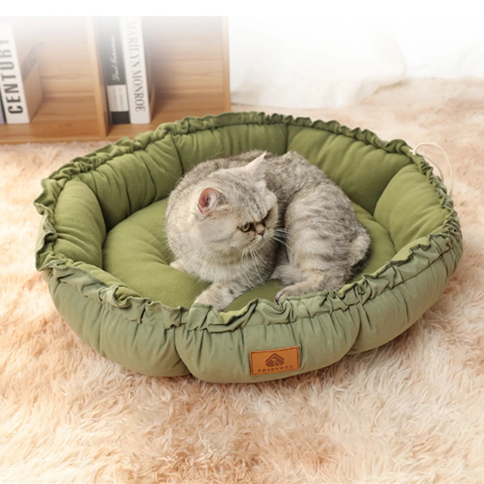 Grey and green reversible donut-shaped pet bed for cats and small dogs, shown in small, medium, and large sizes.