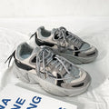 Men's white platform dad sneakers with a lace-up front and thick sole, shown on a grey background.