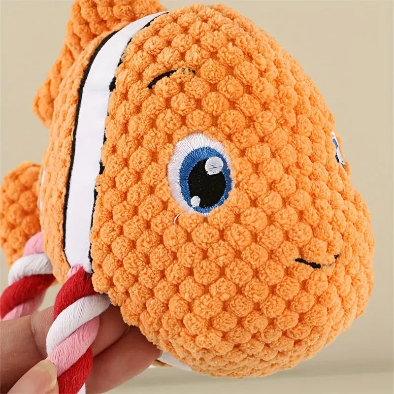 Grey, green, and orange turtle-shaped plush dog chew toy with knotted texture