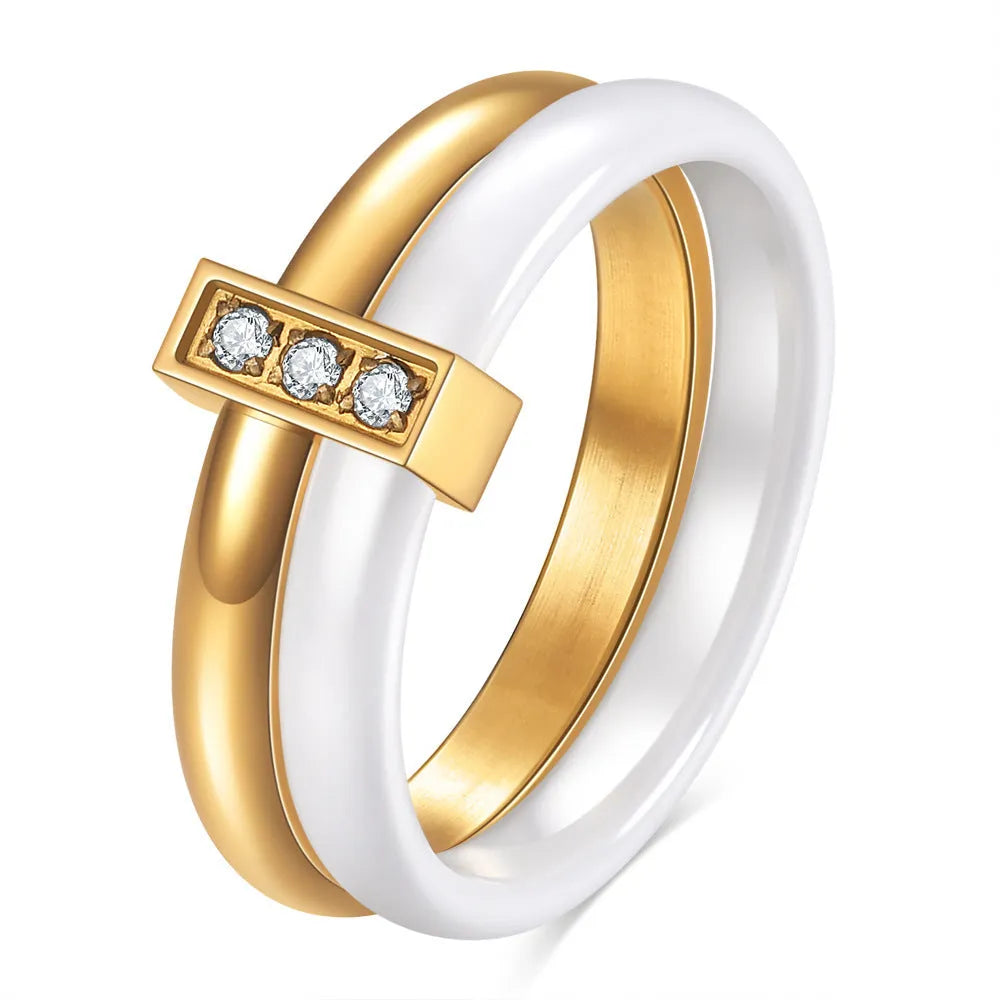 Women's geometric ceramic ring with glossy stitching and inlaid zirconium, in steel black or gold white.