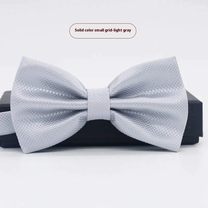 Men's flat head solid colour bow tie in polyester, showing 12cm by 6cm size on a background.