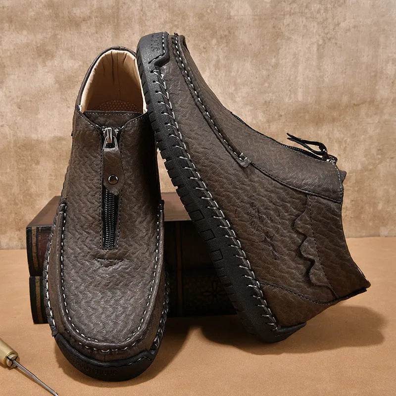 Men's slip-on leather loafers in black, brown, and grey colours showing round toe and rubber sole