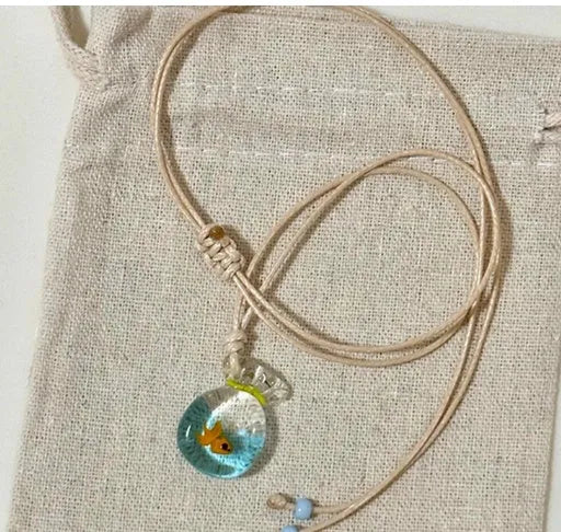 Women's coloured glaze pendant necklace with cotton linen chain featuring Skirt Everyday Joker design