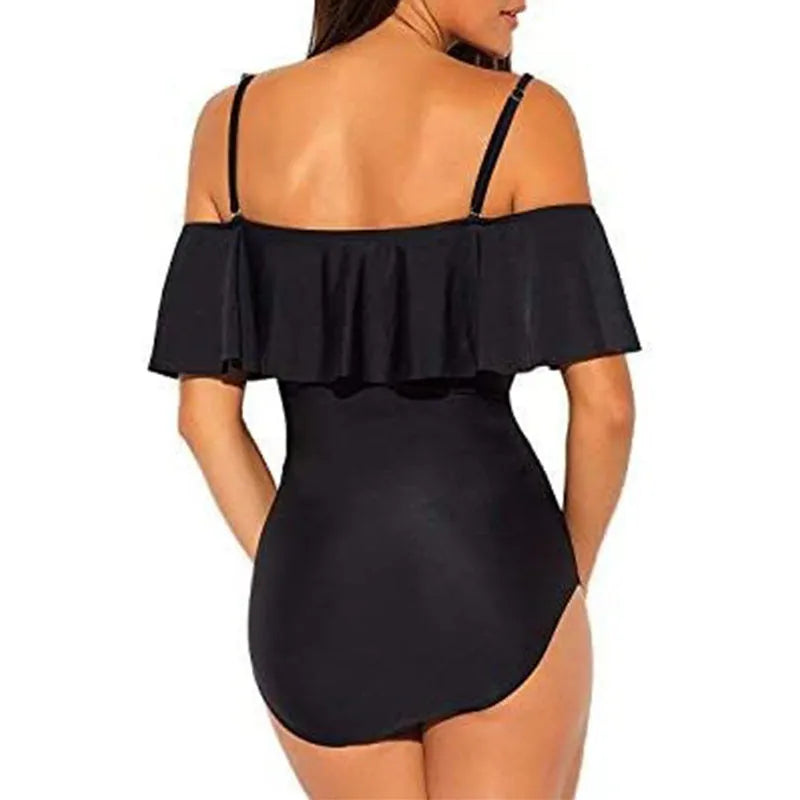 Black one-piece swimsuit with cut-out design and ruffled tube top style straps