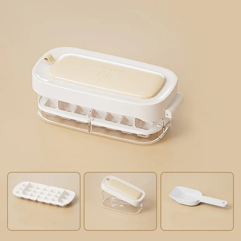 Yellow lever-operated ice cube tray grid with high capacity design and stored ice shovel.