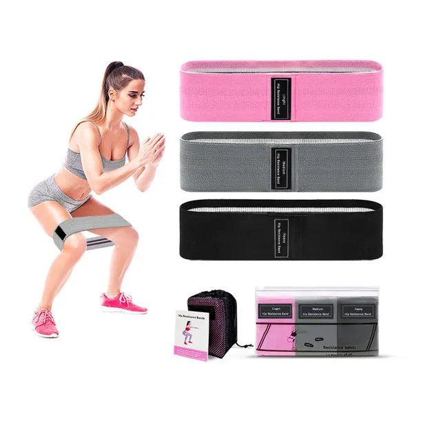 Set of three fabric resistance bands in lake blue, pink, and purple colours with net storage bag
