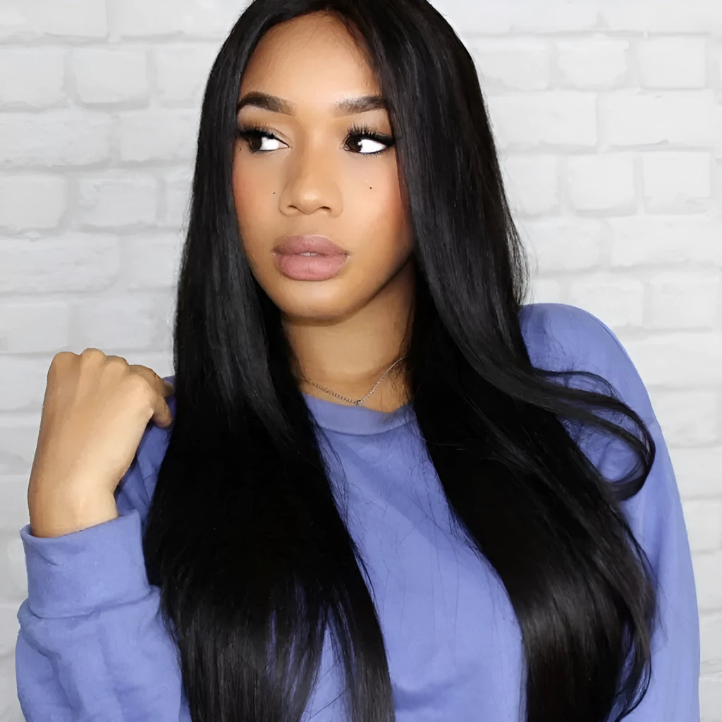 Long straight synthetic wig with centre-parted bangs in black colour on display