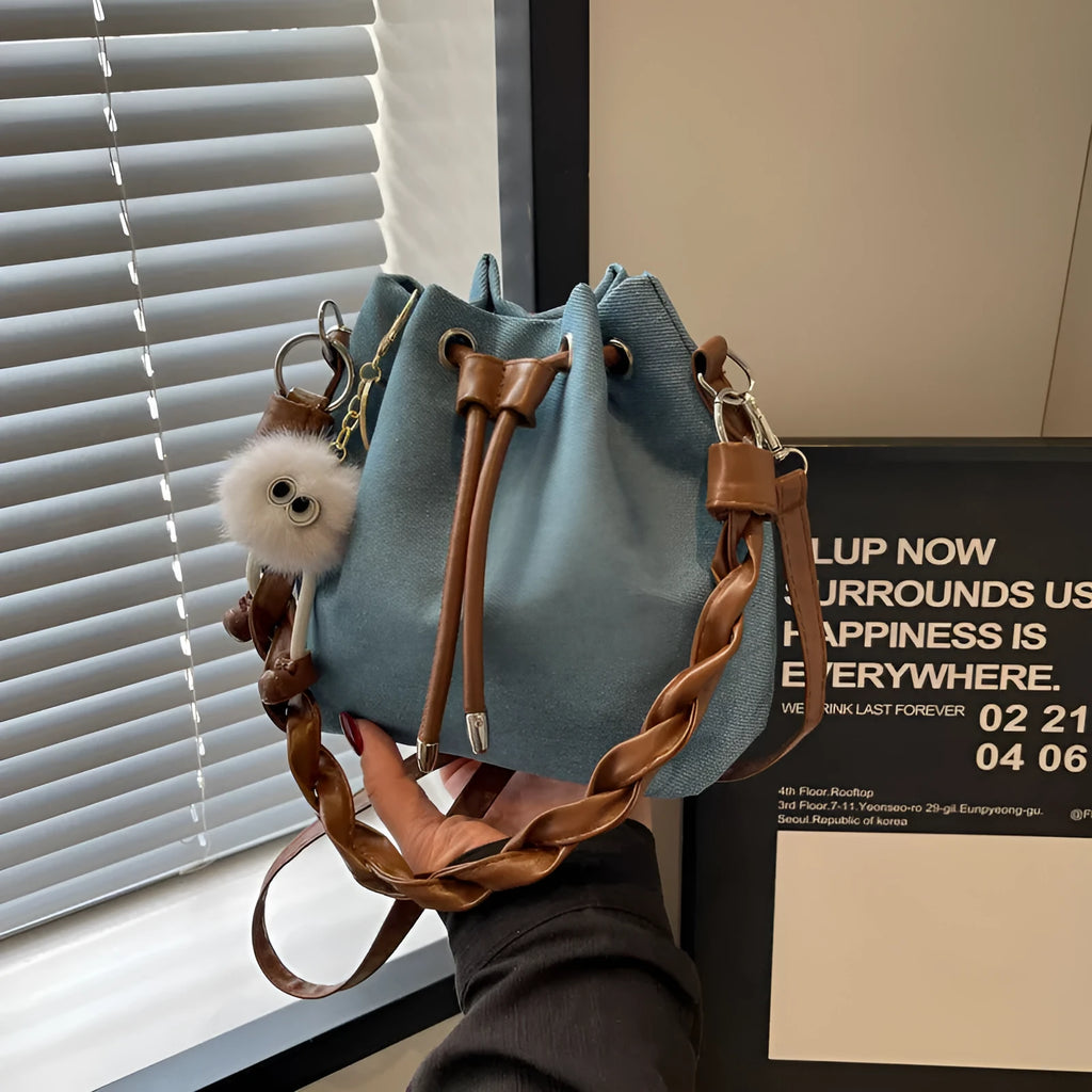 Blue synthetic leather cross body bucket messenger bag with sandwich pocket design
