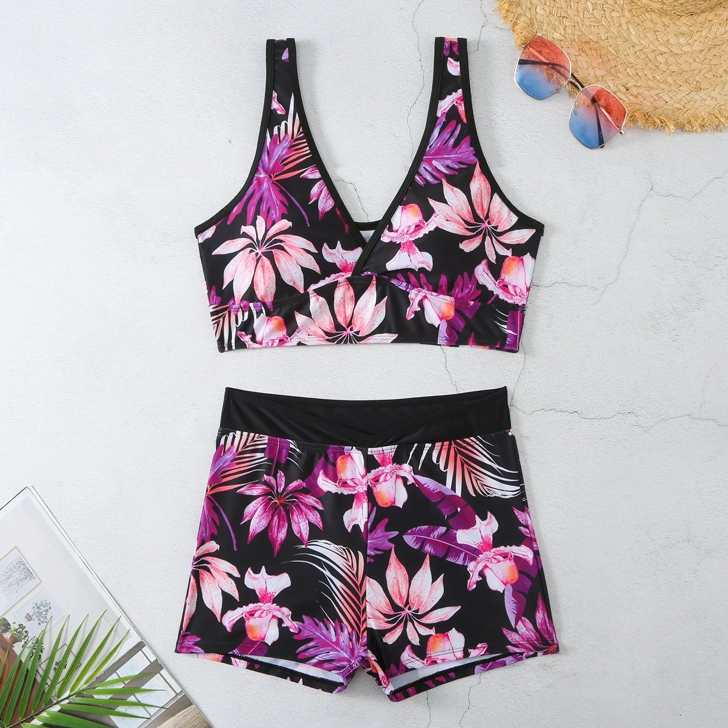 Women's two-piece sleeveless swimsuit with boxer shorts in a multi-colour print.
