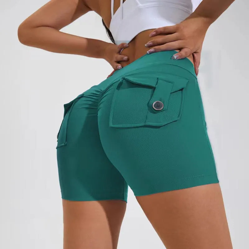 Women's high waist hip lifting fitness shorts in Electric Blue with side pockets.