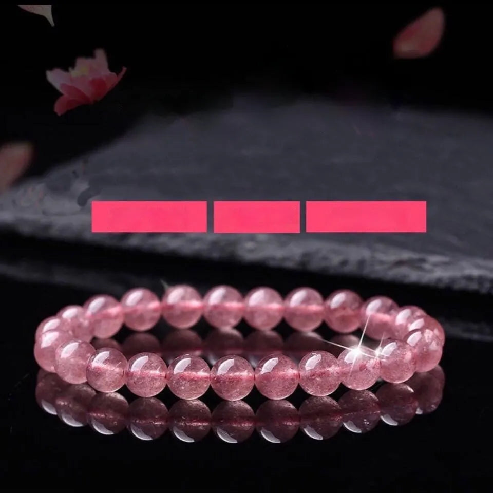 Women's strawberry quartz crystal bracelet with polished beads, showing size options of 6mm, 8mm, and 10mm.