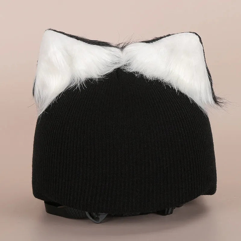 A plush fabric cartoon character helmet hat cover with attached ears on a white background.